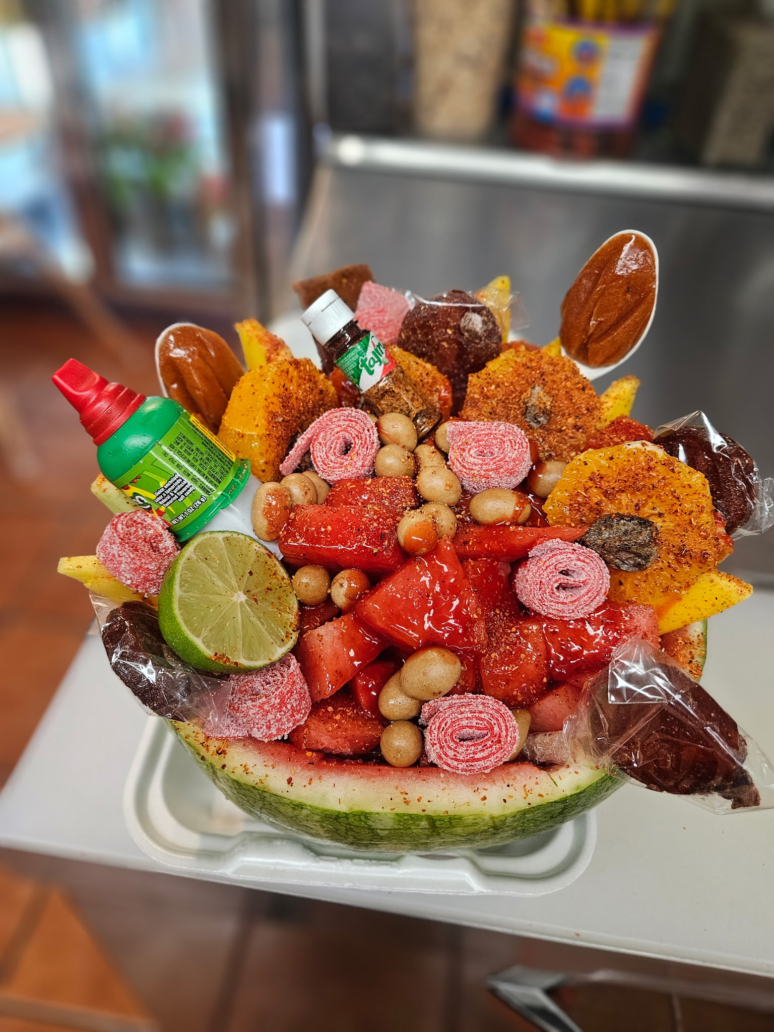 Watermelon bowl loaded with chamoy and candy